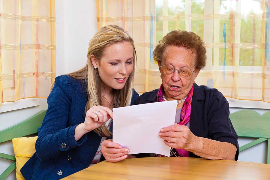 woman and mother looking at tax document